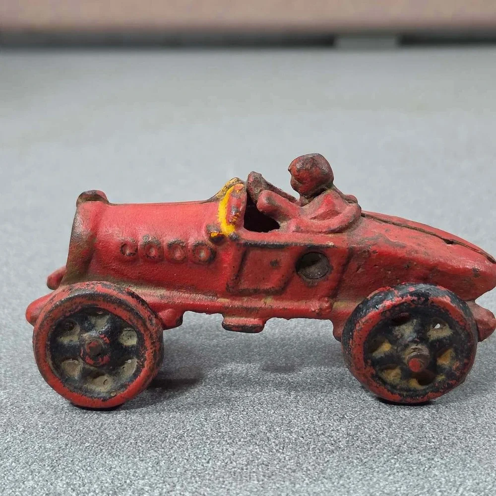 Antique Hubley Cast Iron Boat-tail Race Car Toy Driver 1920's.
